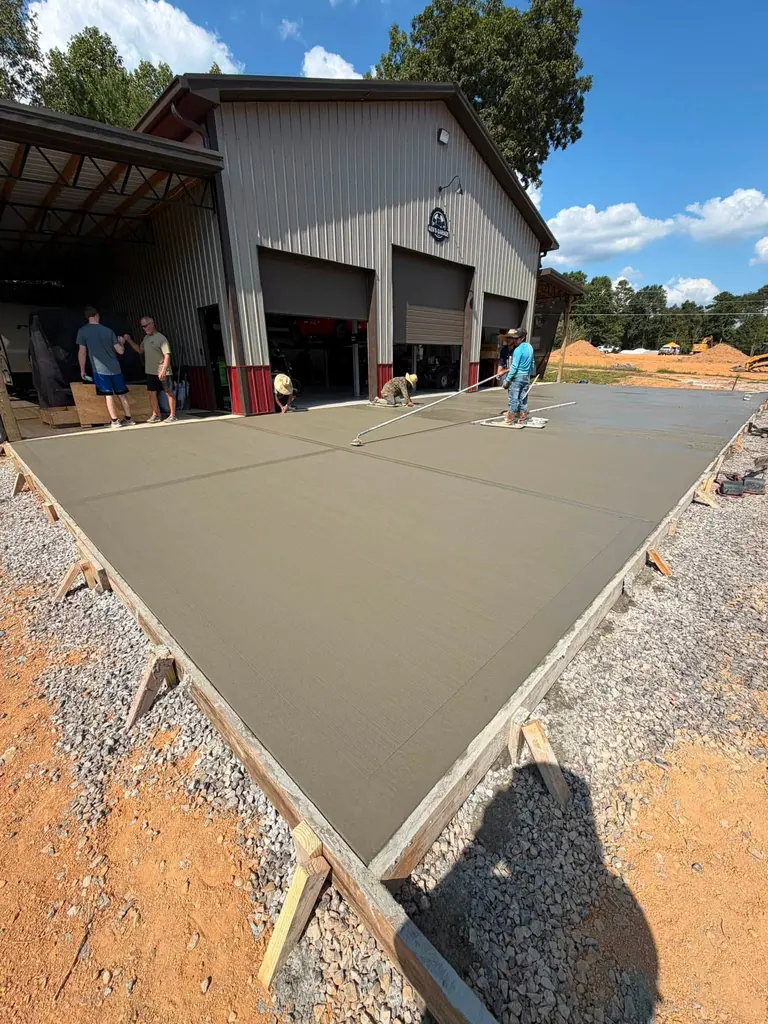 Finished concrete apron in front of a metal shop building in Maryville, Tennessee