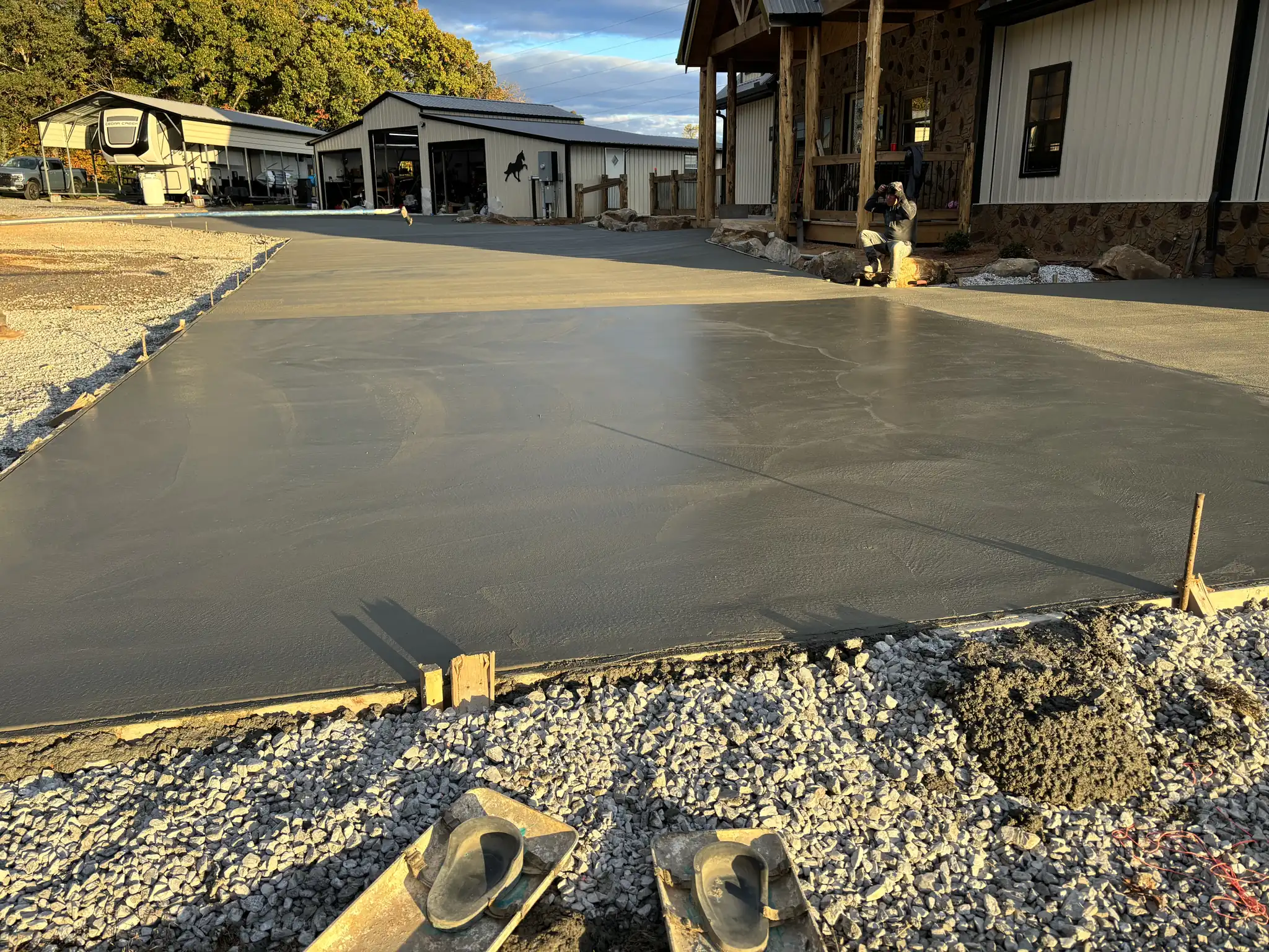 Freshly poured concrete driveway being finished in Maryville, Tennessee