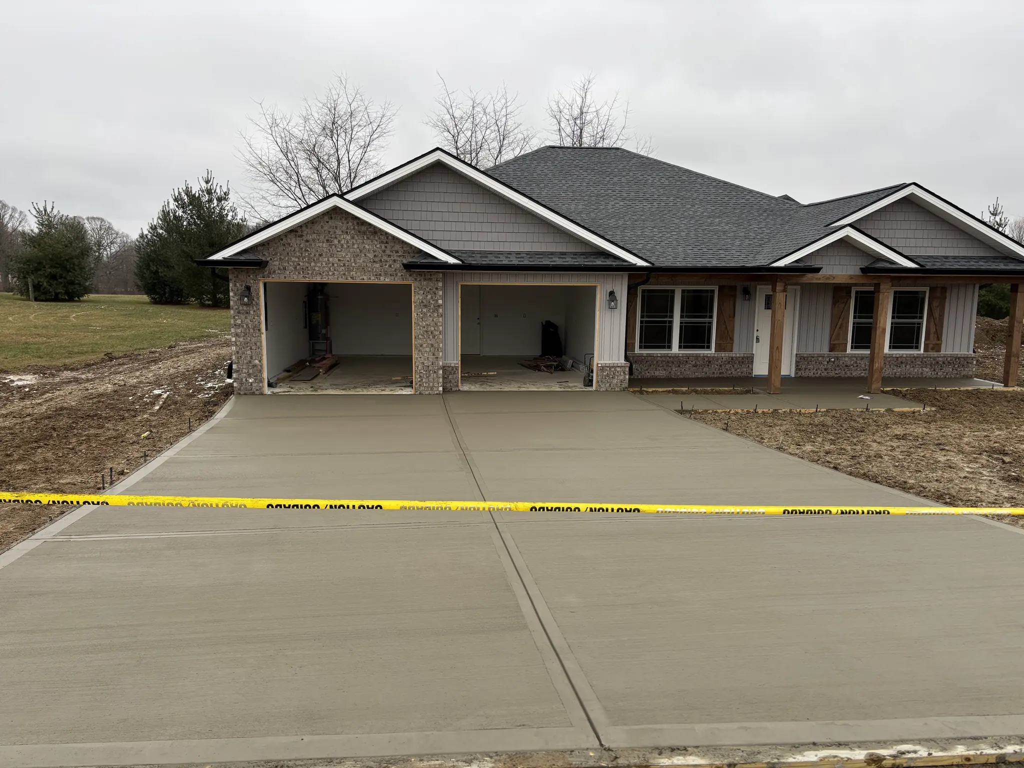 Finished concrete driveway leading up to a new home in Maryville, Tennessee