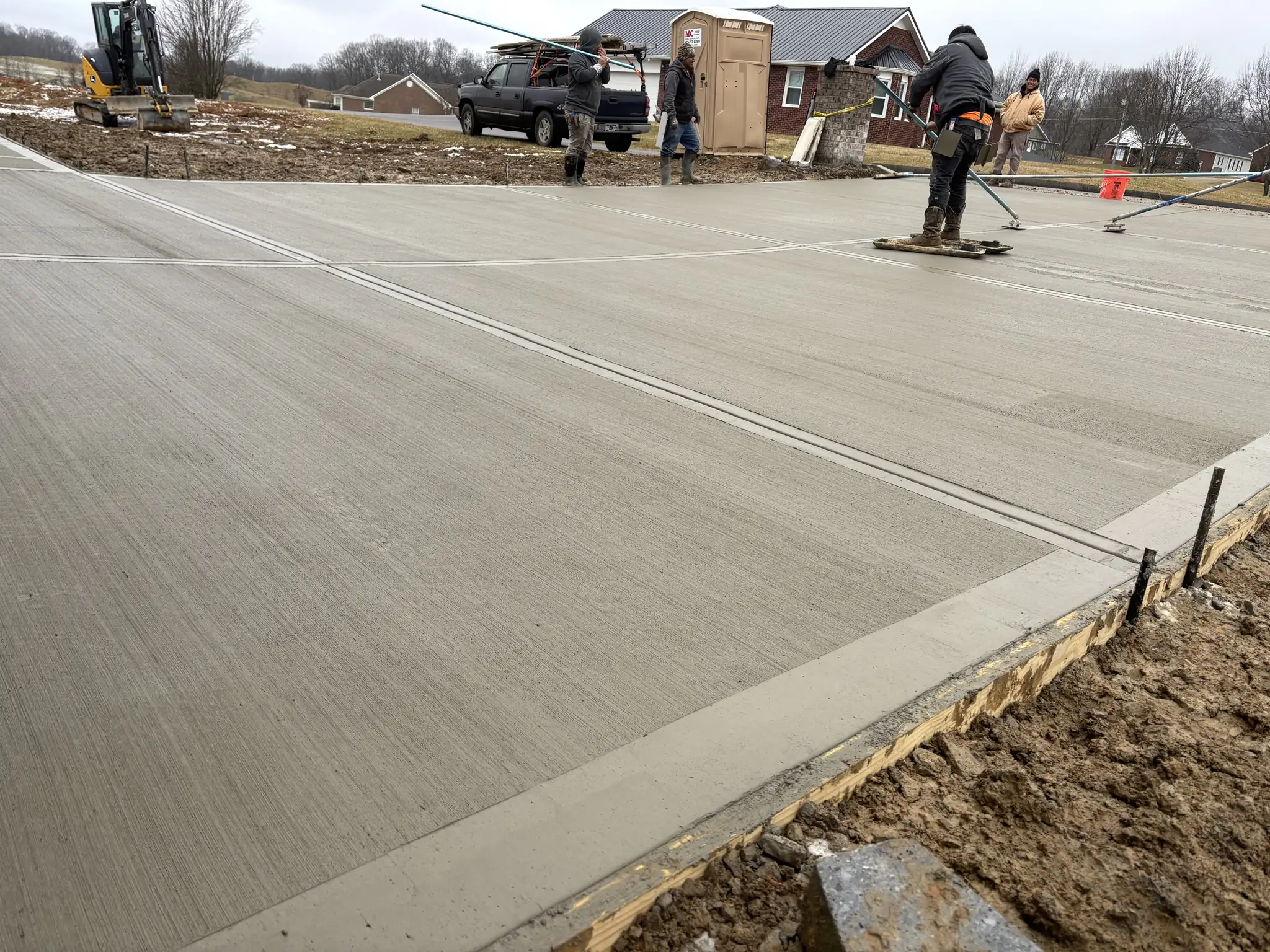 Wide finished concrete driveway poured by Maryville Concrete Pros in Maryville, Tennessee