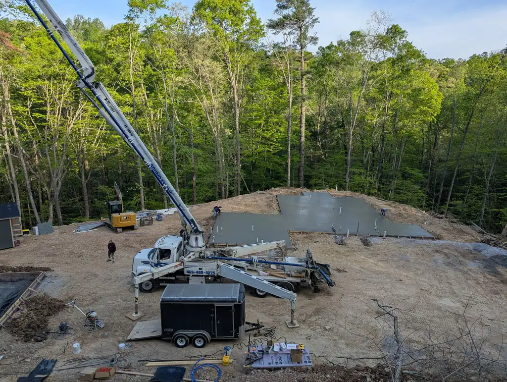 Concrete pump truck with the boom extended on a job site in Maryville, Tennessee