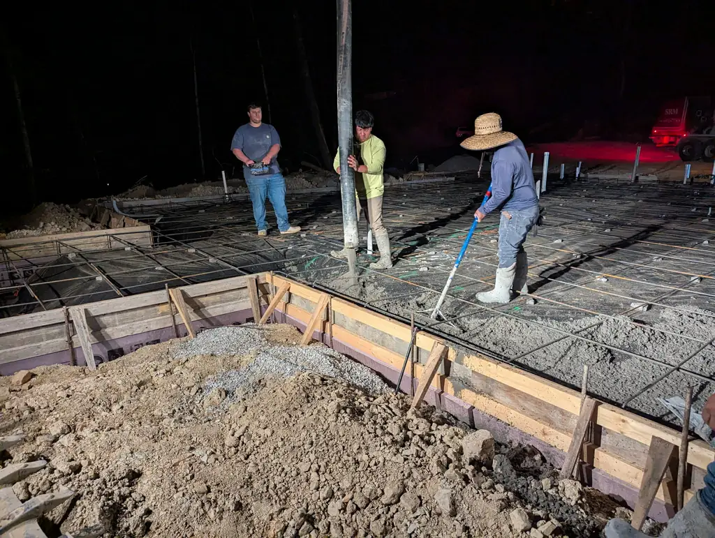 Maryville Concrete Pros crew finishing a slab after dark in Maryville, Tennessee