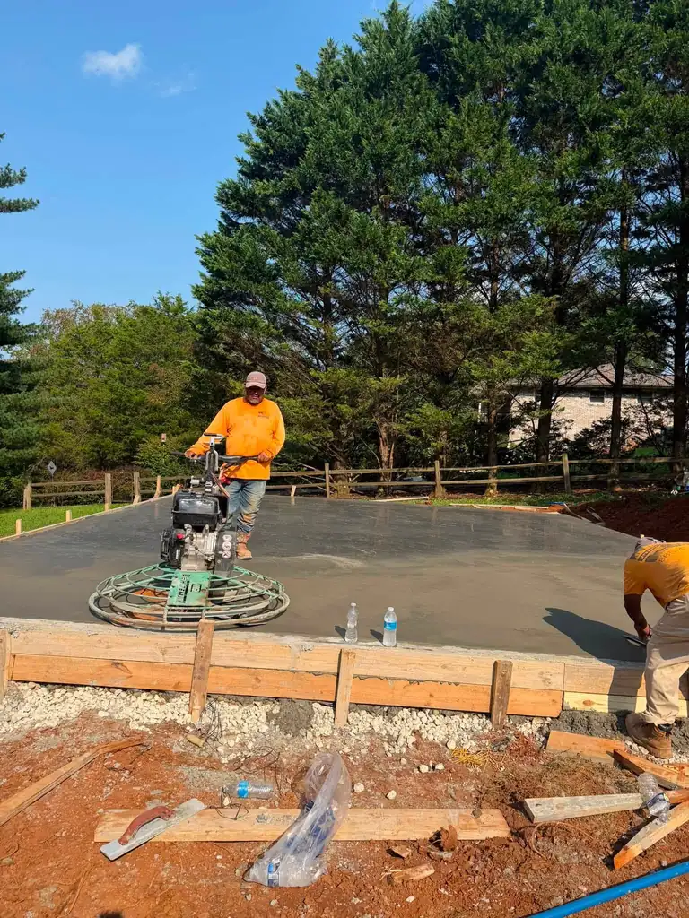 Power trowel finishing a fresh concrete slab in Maryville, Tennessee