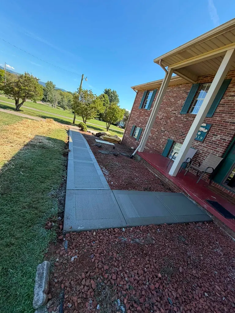 Finished concrete walkway leading to a front porch in Maryville, Tennessee